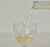 Avaline grenache blanc being poured into a glass.