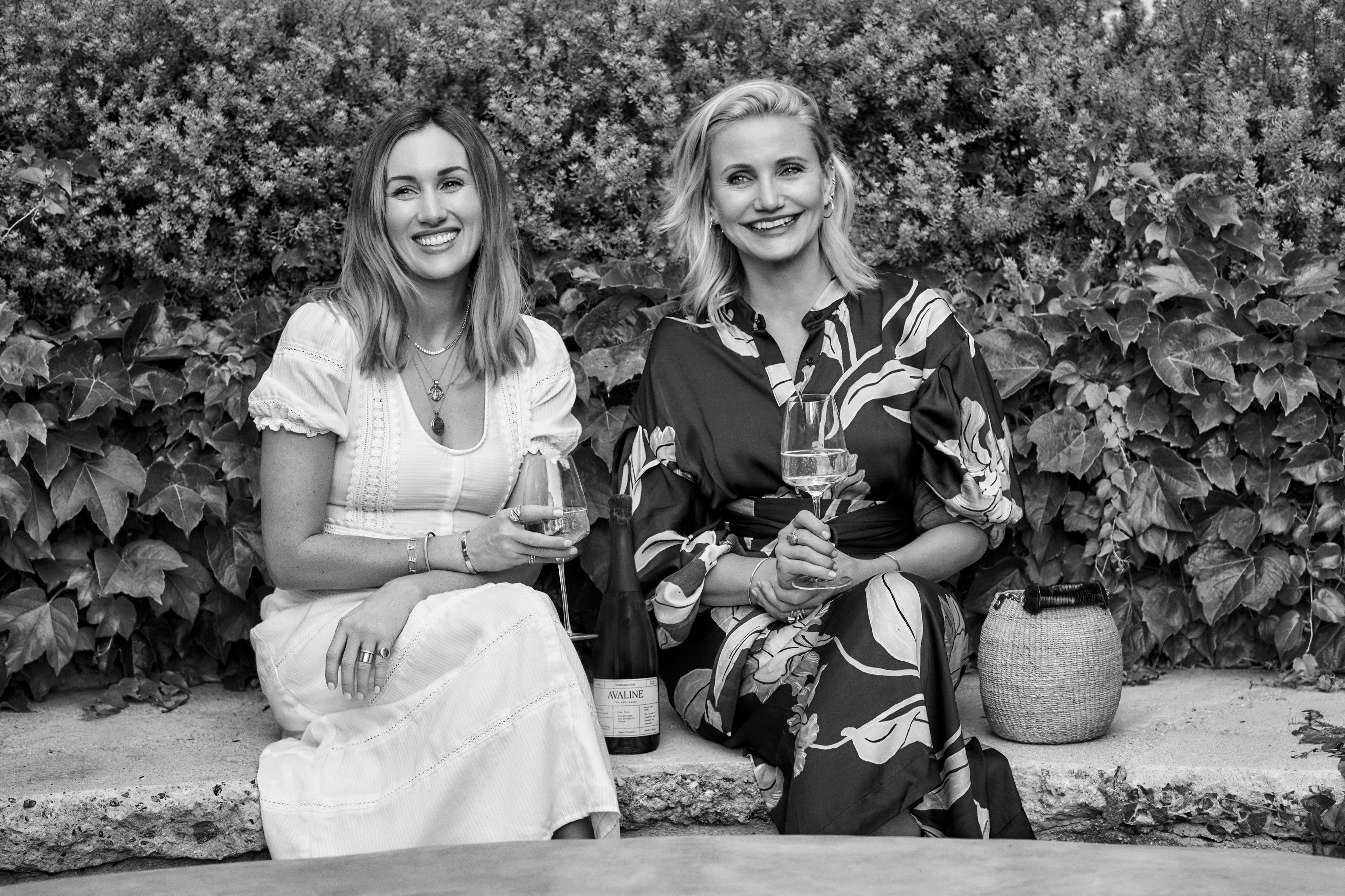 Avaline Founders, Cameron Diaz and Katherine Power, in a garden holding a glass of Avaline wine