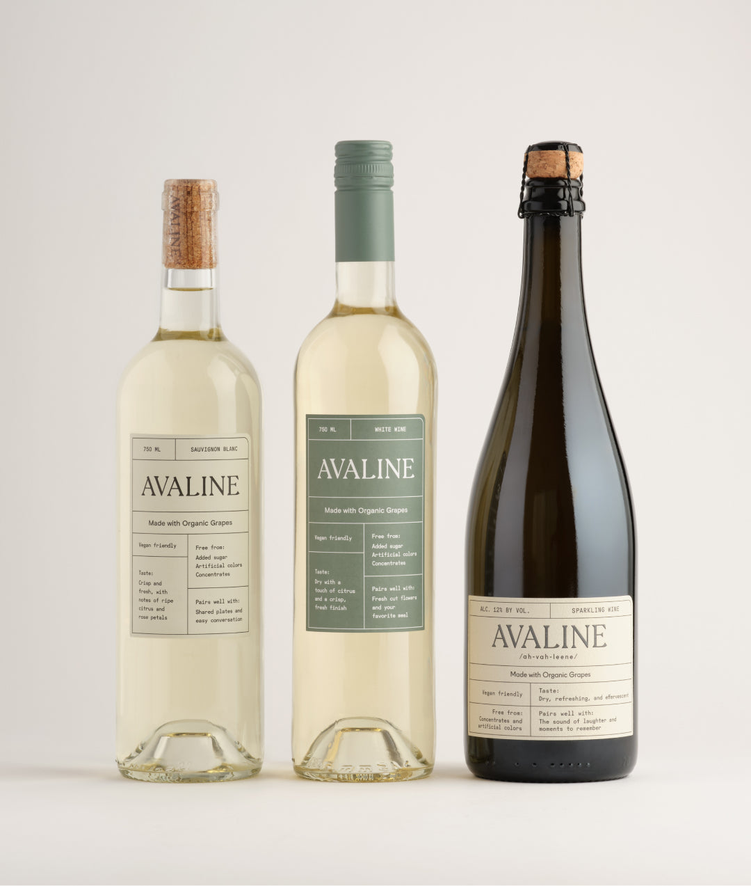 a bundle of white wines including Avaline White, Sauvignon Blanc and Sparkling standing on a table with white background