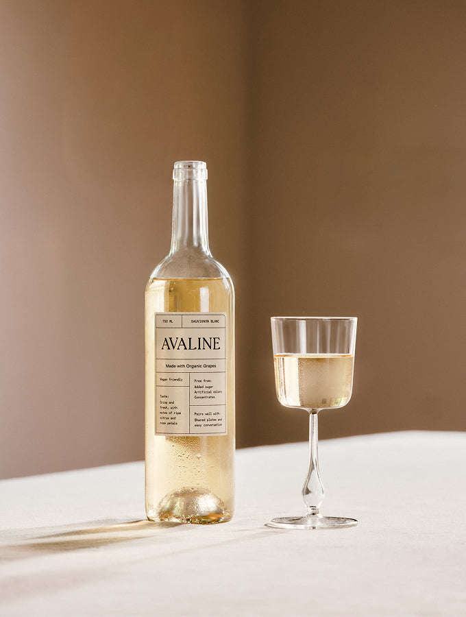 Lifestyle shot of Avaline Sauvignon Blanc and a glass